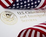 U.S. Citizenship & Immigration Logo & U.S. flag