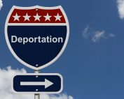 deportation road sign with background clouds