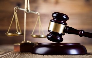 court gavel and justice scales on a table