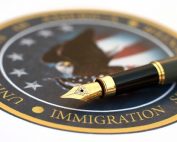 U.S. Immigration Enforcement seal and pen