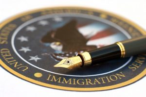 U.S. Immigration Enforcement seal and pen