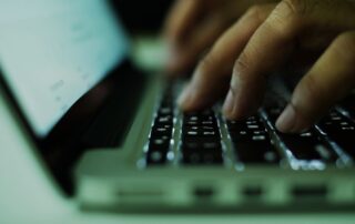 typing on laptop closeup
