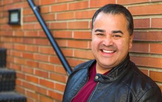 smiling middle aged hispanic man