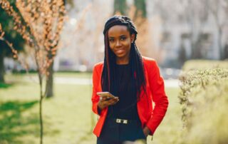a young and professional immigrant woman on her phone