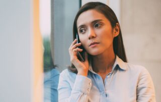 professional woman taking a phone call in her office